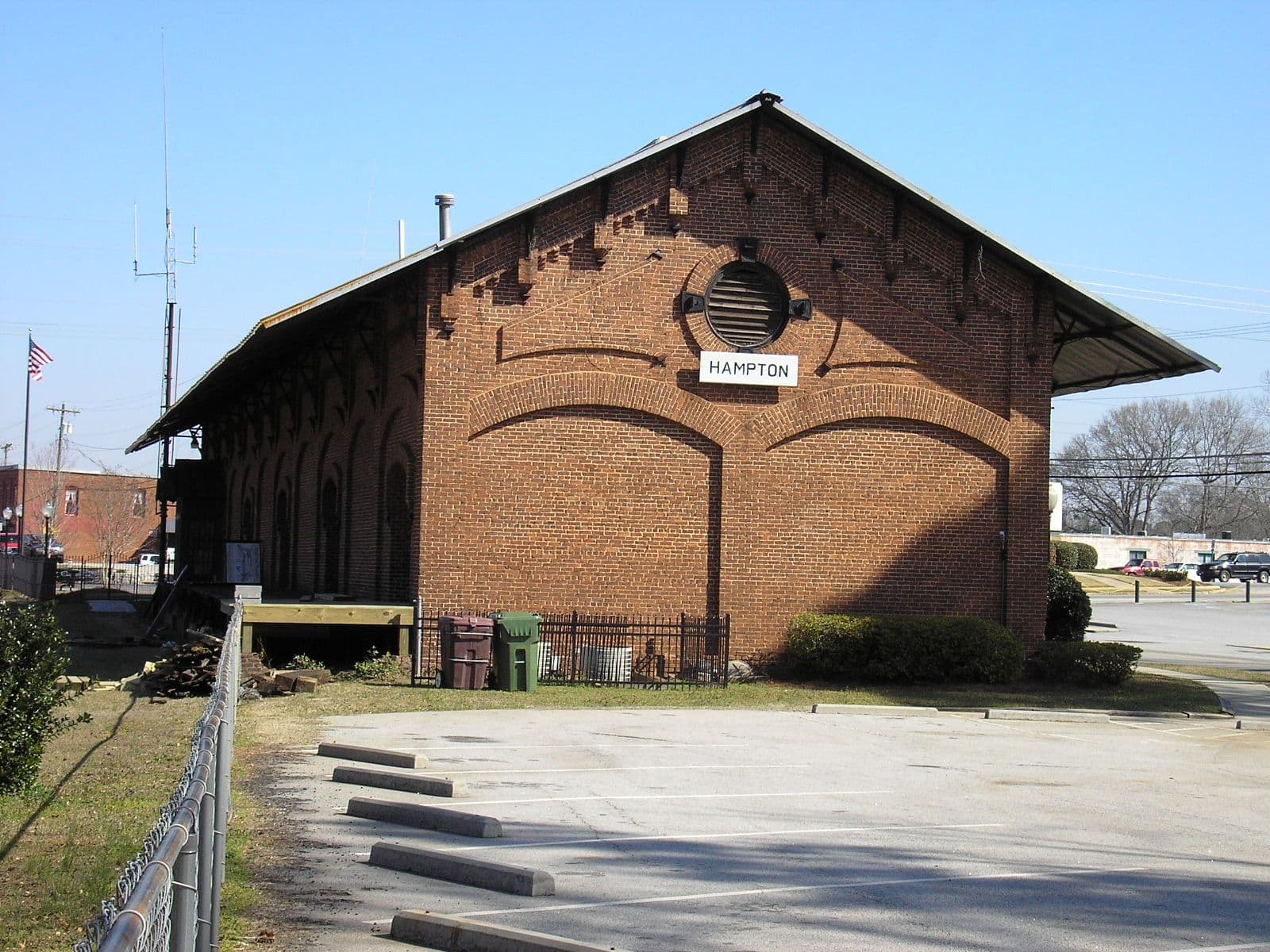 Historic brick Hampton Depot beside the railroad tracks